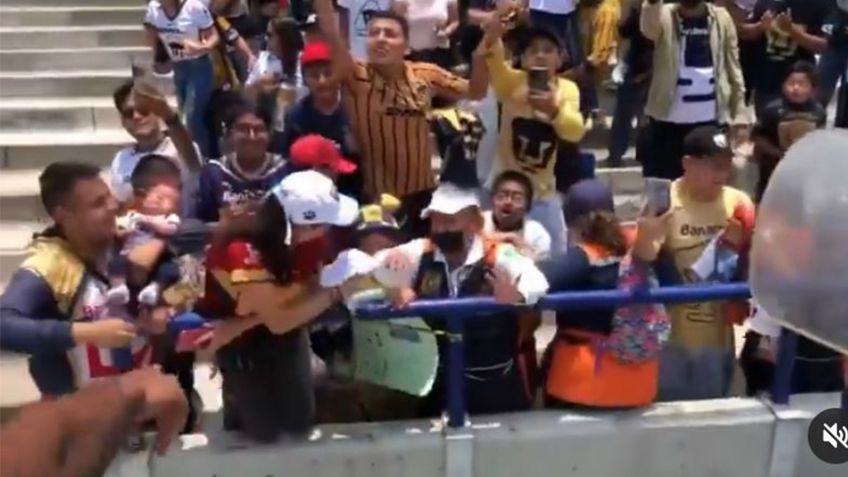 Aficionado de Pumas se vuelve viral por arriesgar la vida de un bebé (VIDEO)